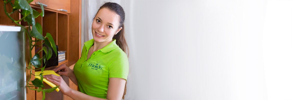 Maids2000 - Service We Offer - Regular Cleanings Maids2000 - Why Us? - Woman Dusting Slider